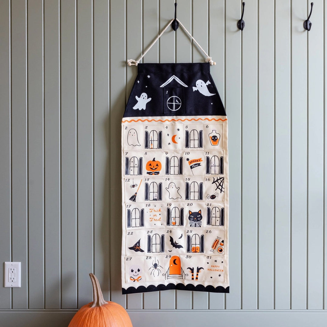 Halloween countdown calendar with ghosts, pumpkins and black cat decorations