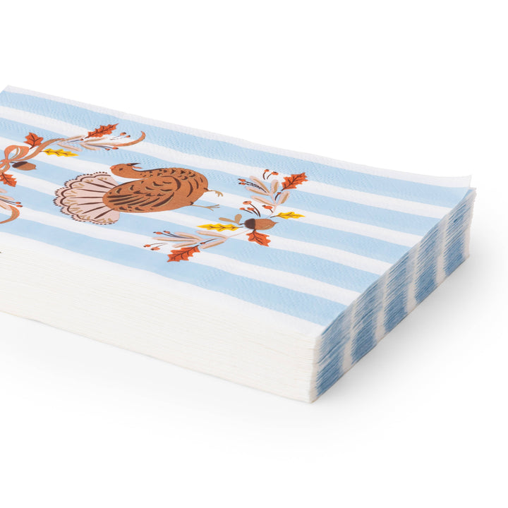 Stack of paper with blue and white striped design and decorative elements on a white background